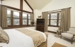 Master suite with king bed, flat screen TV, mountain views, and en-suite bathroom.